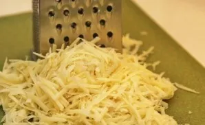 Grate hard cheese.