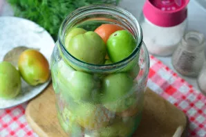 Fill the jar with green or brown tomatoes.