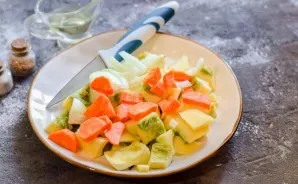 Peel onions and carrots, wash. Cut the vegetables into small pieces.