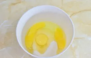 Mix eggs with sugar and beat into a fluffy light foam.