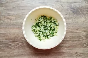 Cut the cucumber into small cubes and put in a bowl.