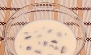 Dip the boiled mushrooms in the egg mixture.