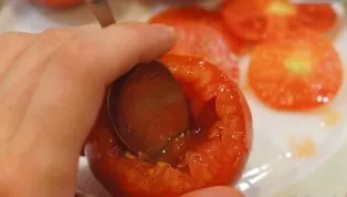 Wash and dry the tomatoes. Cut off the tops and remove most of the pulp with a spoon.