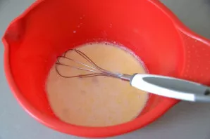 Add melted butter to the milk mixture.