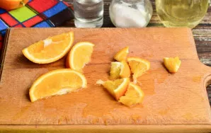 Then cut half an orange into slices.
