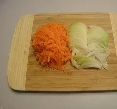 After two hours, chop the onion and carrots.