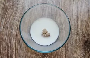 Add yeast, sugar to half the milk and water and mix.