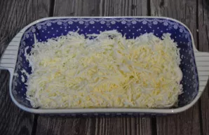 The second layer is grated processed cheese