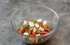 Transfer the vegetables to a bowl. Add diced cheese and pea sprouts.