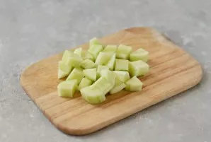 Peel the cucumber too, cut into cubes.