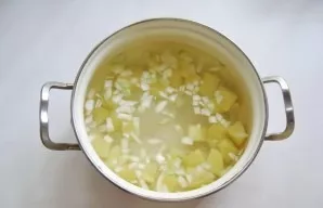 Pour water into a saucepan and cook until the potatoes and onions are tender.