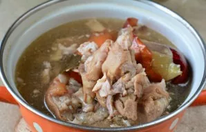 Bring the broth to a boil over medium heat. Then reduce the fire and simmer the chilli for 2.5-3 hours. Then add the peeled whole carrot ...