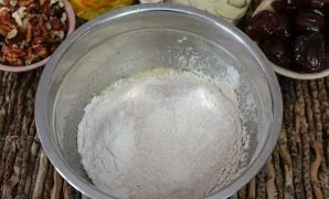 Pour 2 types of flour, whole grain and white wheat.