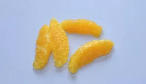 Peel the orange, divide into slices, remove the films.