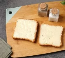 Brush the slices of bread with butter.
