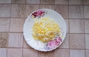 Boil the eggs hard, cool and peel. Grate like a potato.