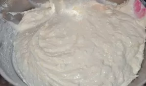 Add sour cream to the cottage cheese and mix thoroughly. Add the sifted flour. Carefully put the egg whites in a bowl and stir until the ...