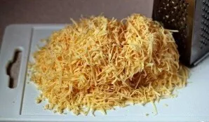 Grate the cheese on a fine grater.