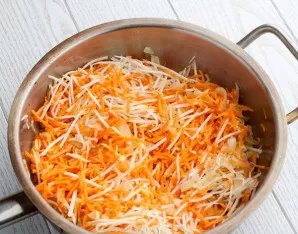 Finely chop the onion and fry until tender. Then add carrots and celery, stew until beautiful golden brown.