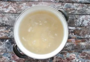 Add chopped potatoes to the boiling broth.