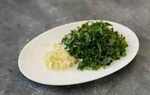 Coarsely chop the greens. Strain the garlic through a press.