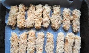 Roll the sticks in flour, then in an egg and sprinkle with breadcrumbs. Perform this procedure a second time to make the coating more dur...