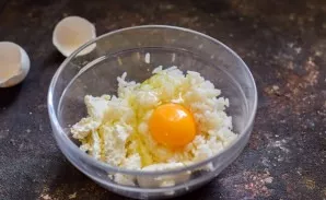 Break an egg into the bowl.