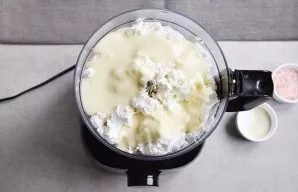 Beat cottage cheese and condensed milk well in the bowl of a food processor.