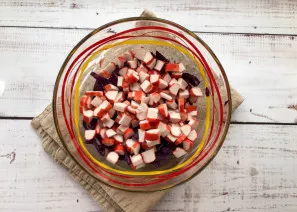 Finely chop the crab sticks and add to the purple cabbage.