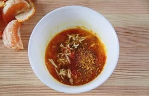 For the marinade, finely grate the peel of one tangerine and squeeze the juice. Put the grated ginger root in it and heat the mixture in ...