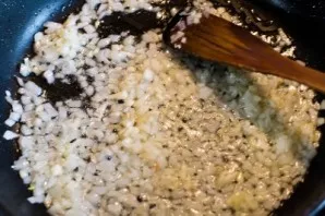 Pour a little oil into the same pan and, stirring constantly, fry the onion and garlic (about 3 minutes). Then add the tomatoes and fry f...