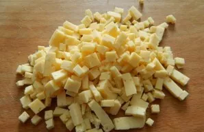 Cut the cheese into small cubes.