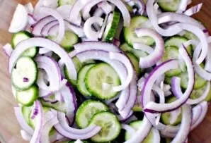 Put cucumbers and onions in a bowl, sprinkle with salt and leave for 10-15 minutes. During this time, the vegetables will release a littl...