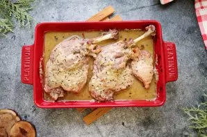 We put the duck in a baking dish and pour it with marinade. Cover the tin with foil and place in a hot oven. Bake the duck at a temperatu...