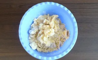 Start kneading with a spoon. As soon as the dough starts to form lumps, knead with your hands.