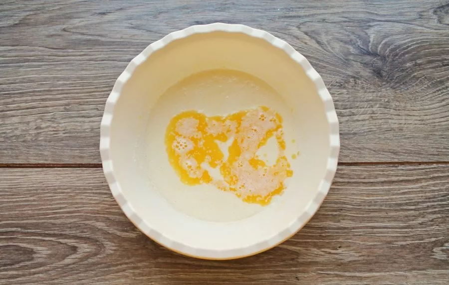 Add melted butter and mix.