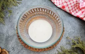 Add sugar and dry yeast to warm milk and mix until smooth. Put the mixture in a warm place so that the yeast begins to act.