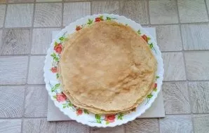 Heat the pan, preferably with a non-stick coating. If you have a regular pan, grease it with oil before each pancake. Pour the dough into...