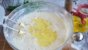 Add flour in portions, mix well until smooth. Add vegetable oil and salt.