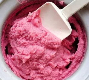 Pour the cooled strawberry mixture into an ice cream maker and freeze according to the manufacturer's instructions.