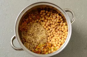 Add chickpeas and washed rice.