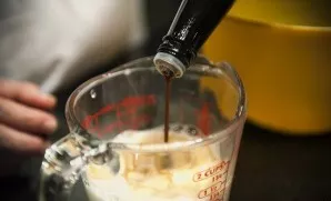 Pour milk, two eggs and a couple of tablespoons of worcestershire sauce into a separate bowl and beat everything thoroughly.