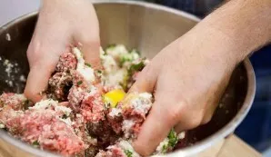 Put the minced pork and beef in a bowl, add both types of grated cheese, eggs, salt, oregano, ground pepper, chopped garlic, parsley, bag...