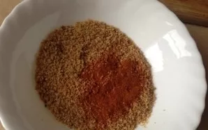 Mix breadcrumbs with ground paprika.