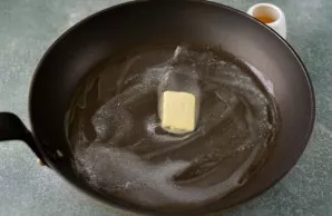 While the chocolate is cooling, heat some butter in a pan.