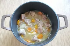 Fry vegetables with meat for 10 minutes, stirring occasionally. After pouring the broth, cover the pot with a lid and simmer the pork unt...