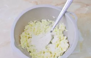 Add soda. Gradually add the flour and add to the dough. You do not need a blender to prepare the dough. A fork or spoon is enough. You ca...