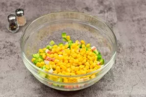 Put crab sticks, cucumbers and corn in a salad bowl.