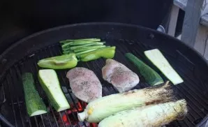 Lay out vegetables, chicken and corn on a preheated grill. Be careful and constantly turn over the ingredients. In addition, be careful, ...