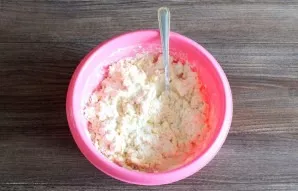 Start kneading the dough with a spoon. When the dough begins to form clumps, knead with your hands.